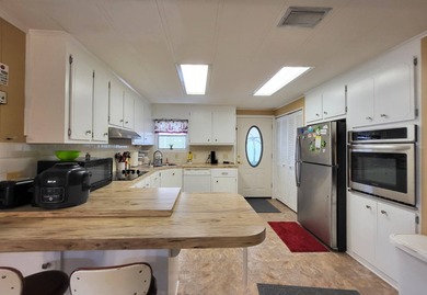 BRAND NEW HVAC SYSTEM 2026! Just listed in Camelot Lakes. Fully - photo 12