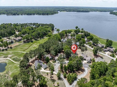 Located in Reynolds Landing, this lakeview home offers access to - photo 2