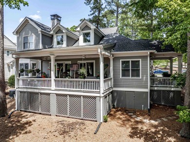 Located in Reynolds Landing, this lakeview home offers access to - photo 3