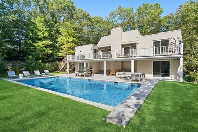 Tucked behind a dramatic gated entry in one of East Hampton's - photo 1
