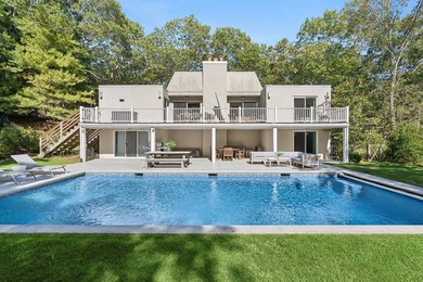 Tucked behind a dramatic gated entry in one of East Hampton's - photo 2