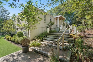 Tucked behind a dramatic gated entry in one of East Hampton's - photo 3