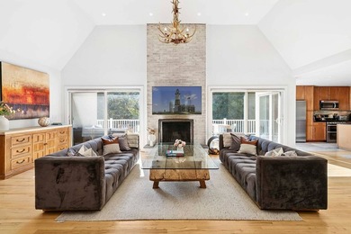 Tucked behind a dramatic gated entry in one of East Hampton's - photo 4