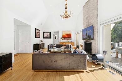 Tucked behind a dramatic gated entry in one of East Hampton's - photo 5