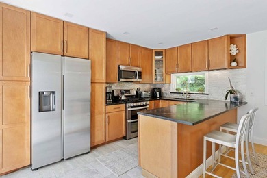 Tucked behind a dramatic gated entry in one of East Hampton's - photo 8
