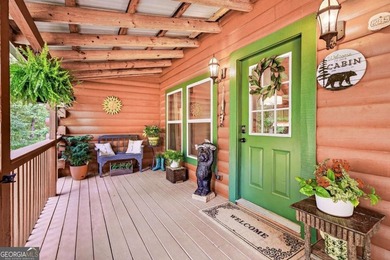 Fully furnished true log home on 5.78 private wooded acres in - photo 3