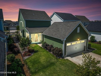 Some homes check boxes. This one sets standards. Nestled in the - photo 2