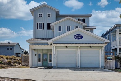 Experience coastal luxury in this stunning 3-story Port Aransas