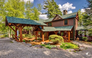 Kiwassa Lake Lodge sits above the shoreline in a way that - photo 12