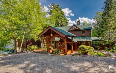 Kiwassa Lake Lodge sits above the shoreline in a way that - photo 13
