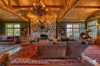 Kiwassa Lake Lodge sits above the shoreline in a way that - photo 17