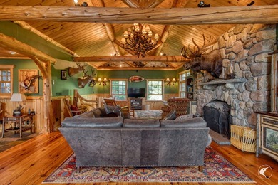 Kiwassa Lake Lodge sits above the shoreline in a way that - photo 18