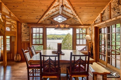 Kiwassa Lake Lodge sits above the shoreline in a way that - photo 24