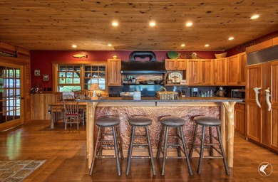Kiwassa Lake Lodge sits above the shoreline in a way that - photo 26