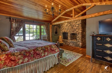 Kiwassa Lake Lodge sits above the shoreline in a way that - photo 37