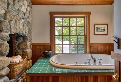 Kiwassa Lake Lodge sits above the shoreline in a way that - photo 40