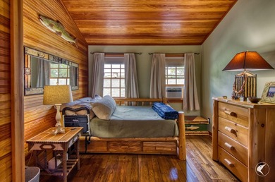 Kiwassa Lake Lodge sits above the shoreline in a way that - photo 43
