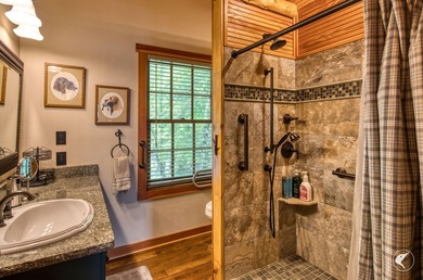 Kiwassa Lake Lodge sits above the shoreline in a way that - photo 50