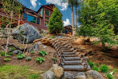 Kiwassa Lake Lodge sits above the shoreline in a way that - photo 59