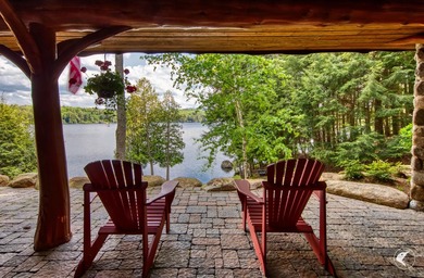 Kiwassa Lake Lodge sits above the shoreline in a way that - photo 60