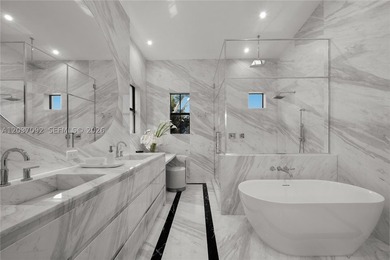 Completely renovated in 2025, this gated three-story residence - photo 15