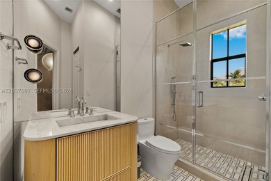 Completely renovated in 2025, this gated three-story residence - photo 20
