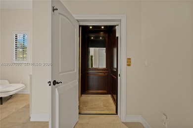 Completely renovated in 2025, this gated three-story residence - photo 22