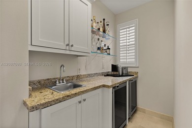 Completely renovated in 2025, this gated three-story residence - photo 23