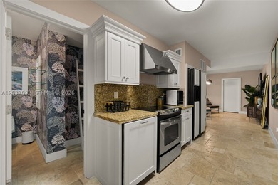 Completely renovated in 2025, this gated three-story residence - photo 29
