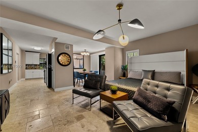Completely renovated in 2025, this gated three-story residence - photo 30