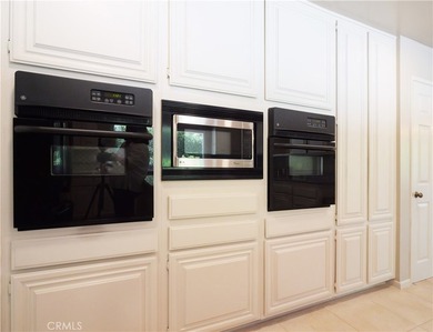 Situated on a quiet street overlooking a lush greenbelt in the - photo 14