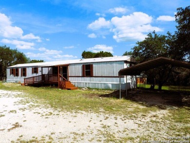 Charming 1.51-acre corner lot with beautiful Hill Country views - Lake Home For Sale in Lakehills, Texas