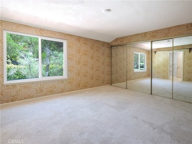 Situated on a quiet street overlooking a lush greenbelt in the - photo 24