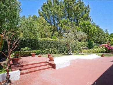Situated on a quiet street overlooking a lush greenbelt in the - photo 39