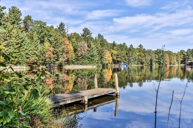 Tucked along the shores of beautiful Rest Lake on the coveted - photo 16