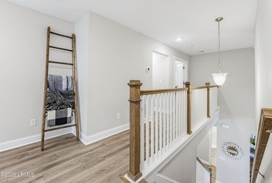 Beautifully set on a private, wooded lot in the sought-after - photo 22