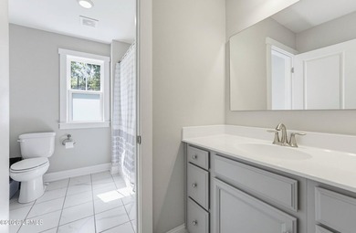 Beautifully set on a private, wooded lot in the sought-after - photo 31