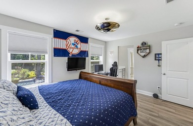 Beautifully set on a private, wooded lot in the sought-after - photo 34