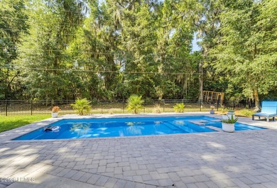 Beautifully set on a private, wooded lot in the sought-after - photo 40
