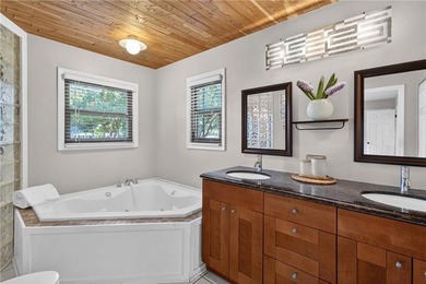 Tucked among mature trees on a large private lot in the - photo 17