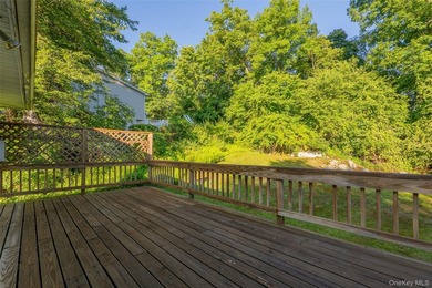 Welcome to 18 Sheryl Lane, a spacious raised ranch nestled on a - photo 35