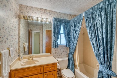 Opportunity awaits in this quaint brick home with a tile roof - photo 12