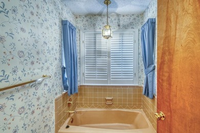 Opportunity awaits in this quaint brick home with a tile roof - photo 17