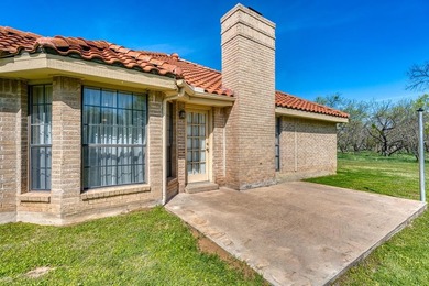 Opportunity awaits in this quaint brick home with a tile roof - photo 24