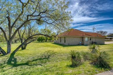 Opportunity awaits in this quaint brick home with a tile roof - photo 26