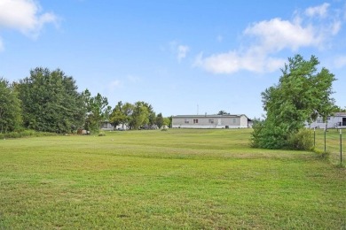 1.4 acres, this doublewide manufactured home offers four