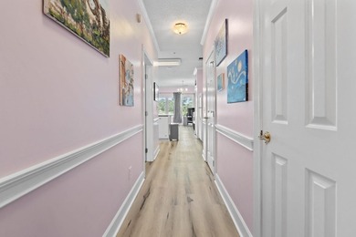 This stunning second-floor 1-bedroom, 1.5-bath condo offers - photo 15