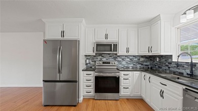 Enjoy lakefront living at its best in this beautifully remodeled - photo 13