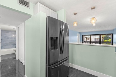 Newly remodeled 2/2 waterfront North Palm condo available on the - photo 15