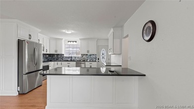 Enjoy lakefront living at its best in this beautifully remodeled - photo 16